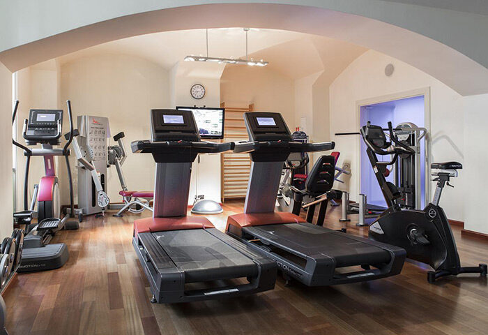 Gym at NH Collection Carlo IV, Prague. This luxury hotel offers fitness facilities for gay travelers in Prague Old Town. Affordable stay!