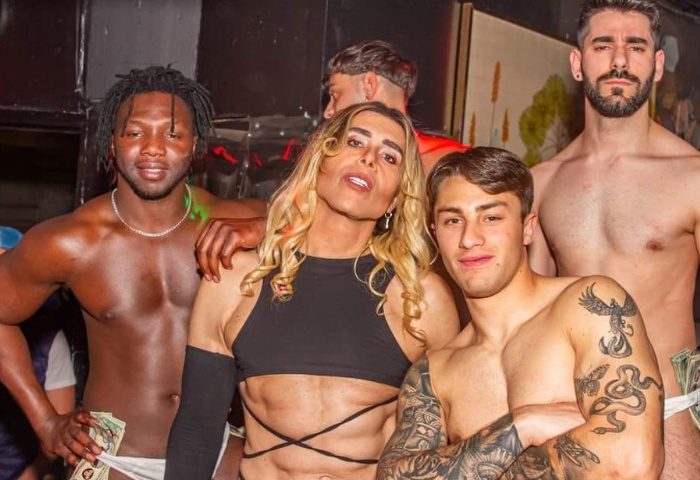 Afterline Milan: Group of shirtless men posing at a gay bar in Milan. Gay travel advice, nightlife, and travel tips.