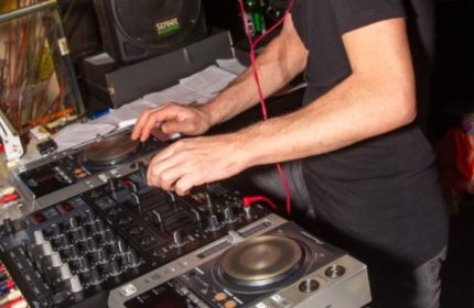 Afterline Milan: DJ spinning records at a gay party. Nightlife scene, music, and entertainment. Milan gay travel advice.