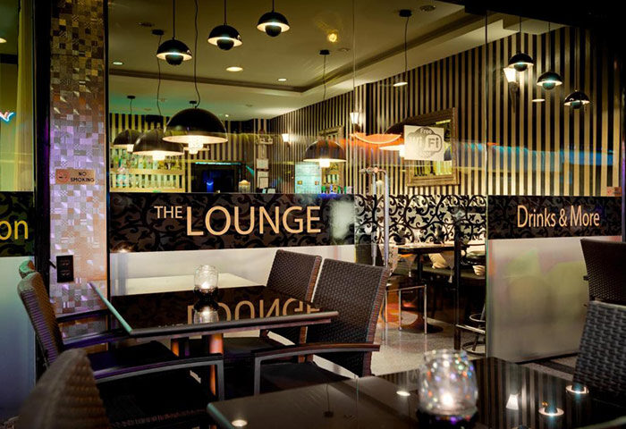 Ambiance Pattaya Hotel's lounge area. A cheap, simple gay hotel in Pattaya, Thailand, known for its vibrant gay nightlife scene.
