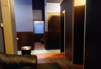 Amigo Sauna Copenhagen interior. Lockers, hallway, and seating area in a gay sauna. Travel advice for gay men in Copenhagen.