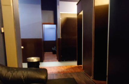 Amigo Sauna Copenhagen interior. Lockers, hallway, and seating area in a gay sauna. Travel advice for gay men in Copenhagen.