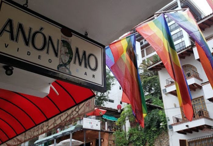 Anonimo Gay Bar in Puerto Vallarta, Mexico. Rainbow flags decorate the entrance to the gay bar. Gay travel destination.