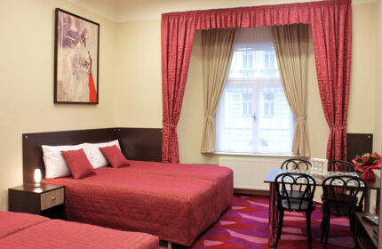 Anyday Apartments Prague: Gay-friendly hotel room in Vinohrady gayborhood. Twin beds, table, chairs, and art. Perfect for gay travel.