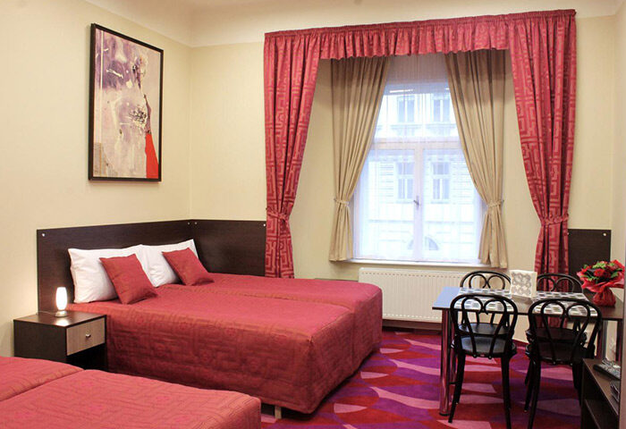 Anyday Apartments Prague: Gay-friendly hotel room in Vinohrady gayborhood. Twin beds, table, chairs, and art. Perfect for gay travel.