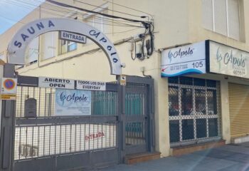 Apolo Sauna Cabaret, a gay sauna in Torremolinos. Entrance to the gay venue with signs in Spanish and English. A popular spot for gay men's travel.