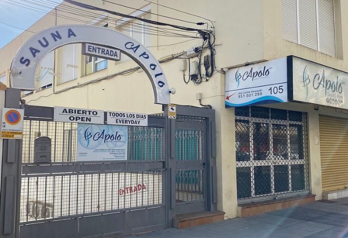 Apolo Sauna Cabaret, a gay sauna in Torremolinos. Entrance to the gay venue with signs in Spanish and English. A popular spot for gay men's travel.
