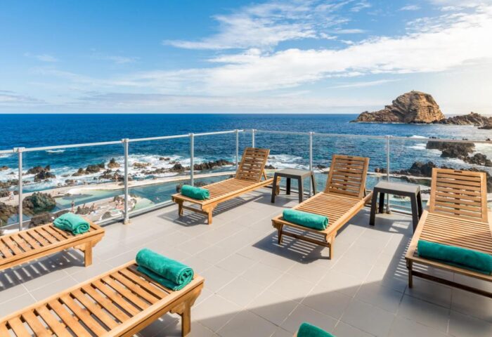 Aqua Natura Madeira: Deck chairs overlook the ocean at this gay-friendly hotel. Perfect for gay men's travel in Madeira.