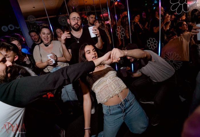 Arena Xperience Gay Club, Barcelona: Crowded dance floor with gay men and women dancing, drinking, and having fun at a gay party in Barcelona.
