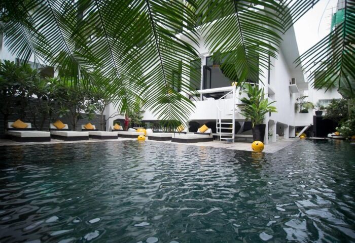 Arthur & Paul men-only hotel pool in Phnom Penh. Gay saunas, sunbeds, and tropical plants surround the pool at this gay-friendly hotel.