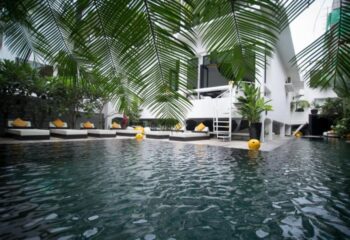 Arthur & Paul men-only hotel pool in Phnom Penh. Gay saunas, sunbeds, and tropical plants surround the pool at this gay-friendly hotel.