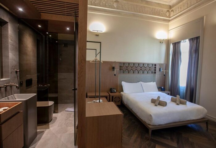 Athens 1890 Hotel & Spa room. Gay-friendly adults-only hotel with modern design. Double bed, bathroom with shower. Stylish, comfortable stay.