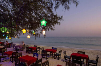 Avatara Resort, Koh Samet. Beachfront dining at this cheap gay hotel near gay bars. Tables under star-shaped lights offer a romantic setting.
