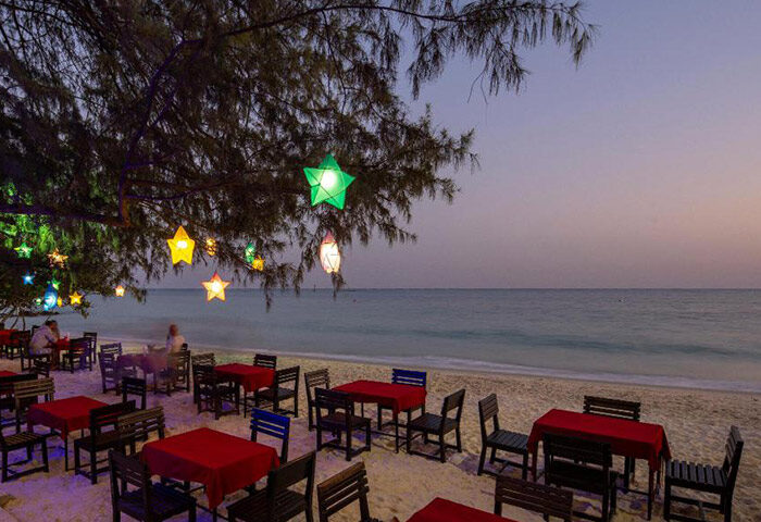 Avatara Resort, Koh Samet. Beachfront dining at this cheap gay hotel near gay bars. Tables under star-shaped lights offer a romantic setting.