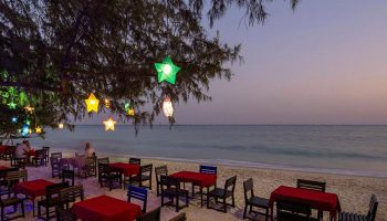 Avatara Resort, Koh Samet. Beachfront dining at this cheap gay hotel near gay bars. Tables under star-shaped lights offer a romantic setting.