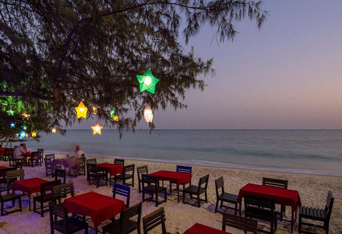 Avatara Resort, Koh Samet. Beachfront dining at this cheap gay hotel near gay bars. Tables under star-shaped lights offer a romantic setting.