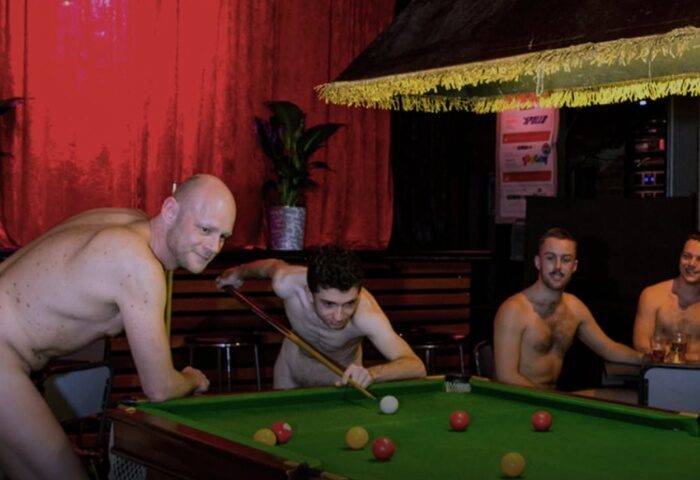 BUFF Events Fitzroy: Shirtless gay men playing pool in a bar. Gay travel advice. Nightlife event.