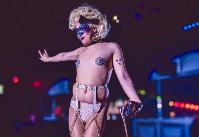 Drag queen at BUFF Events Fitzroy. Blonde wig, mask, pasties, and fishnets. Gay travel advice for queer men's events.