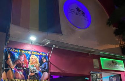 Babiana's gay bar in Mexico. Rainbow flag above the entrance. Poster with performers: Pao Goga, Bella Fitt, Karla La Prima, Joy.