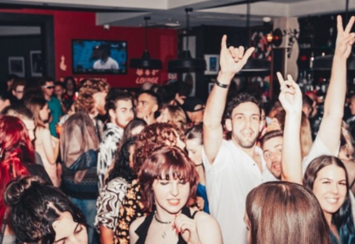 Crowd partying at Bank Hotel Newtown. Gay nightlife in Sydney, Australia. Travel advice for gay men. Lively bar scene.
