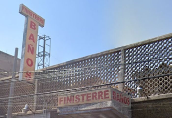 Finisterre Baños, a gay sauna in Mexico. Exterior view of the building with signage. Gay travel in Mexico.