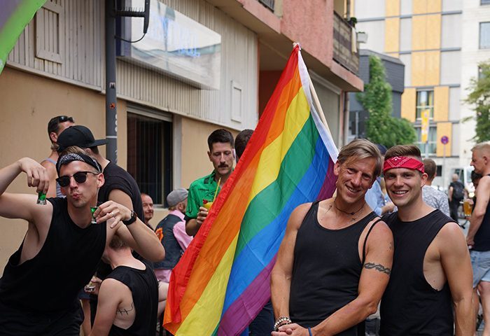 Bar Central Frankfurt: Gay men celebrating with a rainbow flag. Travel advice for gay tourists. Nightlife in Germany.