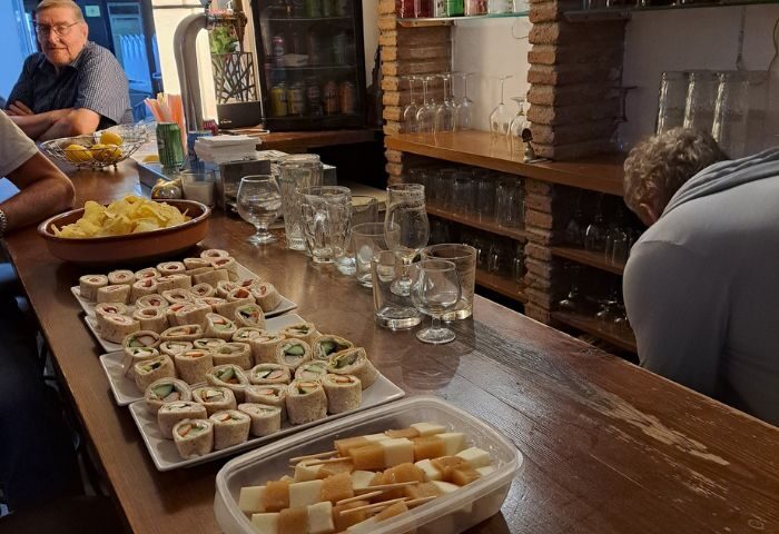 Bar Babel gay bar in Torremolinos. Tapas, cheese skewers, and tortilla wraps on the bar. Gay travel advice, gay nightlife, Spain.