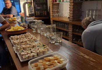 Bar Babel gay bar in Torremolinos. Tapas, cheese skewers, and tortilla wraps on the bar. Gay travel advice, gay nightlife, Spain.
