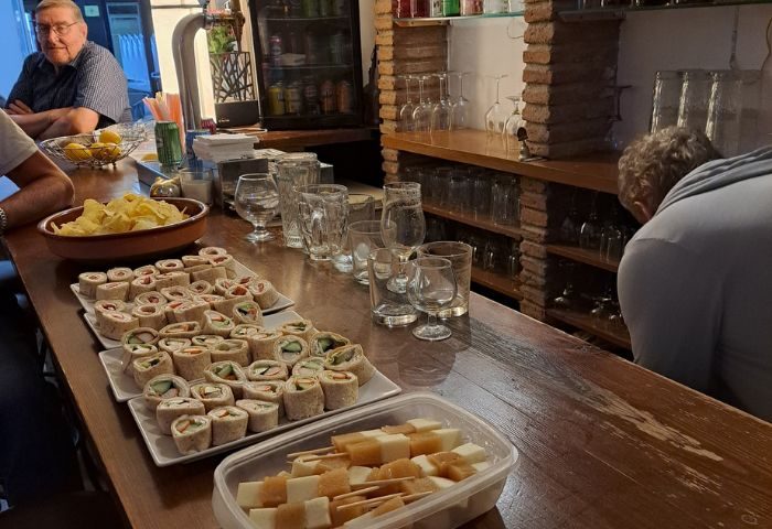 Bar Babel gay bar in Torremolinos. Tapas, cheese skewers, and tortilla wraps on the bar. Gay travel advice, gay nightlife, Spain.