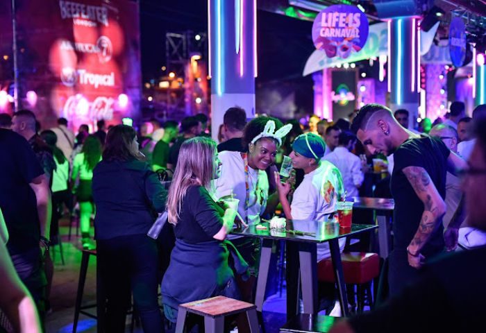 Gay bar Divinity in Gran Canaria. People enjoying drinks, lights, and music. Nightlife scene. Gay travel destination. Carnival atmosphere.
