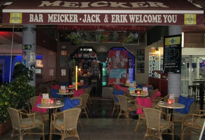 Meicker Bar, a gay bar in Gran Canaria, welcomes guests with outdoor seating and a lively atmosphere. A popular spot for gay men travelers.