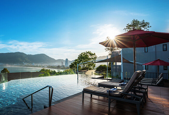 Amari Phuket beachfront hotel near Patong Beach. Infinity pool, sun loungers, and ocean view. Perfect for gay travelers in Thailand.