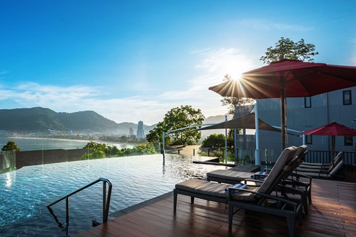 Amari Phuket beachfront hotel near Patong Beach. Infinity pool, sun loungers, and ocean view. Perfect for gay travelers in Thailand.