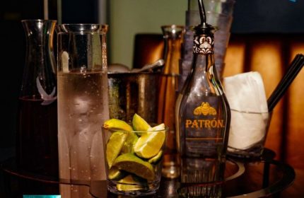 Beaux Gay Bar, San Francisco: Bar scene with Patron tequila, limes, and mixers. A popular spot for gay men's travel and nightlife.