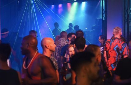 Gay nightlife at Beefcakes gay bar in Puerto Vallarta. Men gather under laser lights to dance and socialize at this popular gay travel destination.