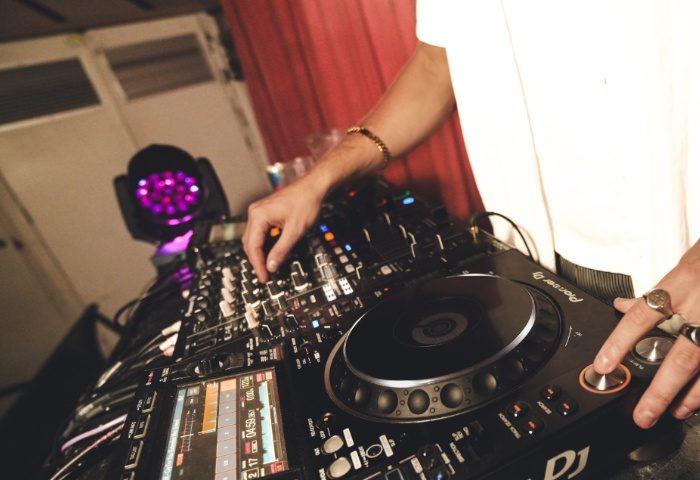 Beresford Hotel Sydney DJ. Gay nightlife travel. DJ mixing music at the Beresford Hotel, a popular gay-friendly venue in Sydney, Australia.