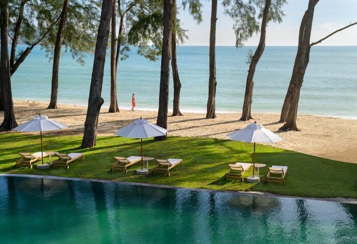 Beachfront at InterContinental Phuket Resort, an IHG Hotel. Gay honeymoon destination with pool, beach umbrellas, and ocean view.