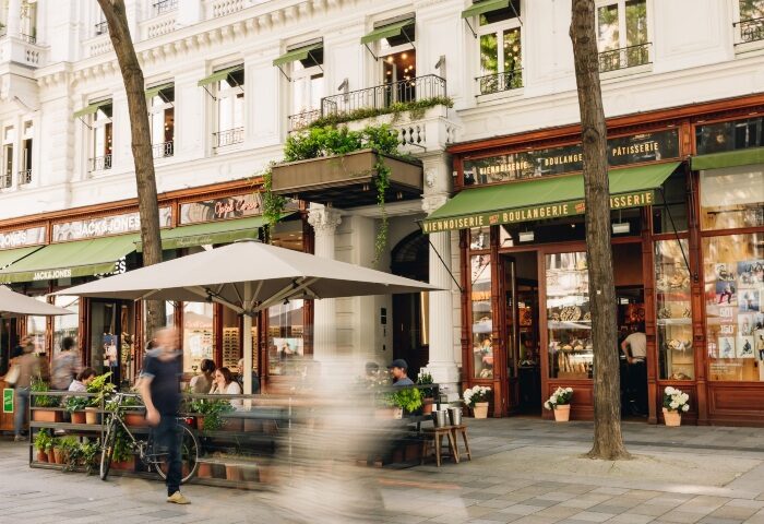 Boutique Hotel MOTTO's bakery-cafe in Vienna's city center. Outdoor seating, charming architecture, and a cozy atmosphere. Best gay-friendly hotel.