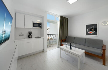 Atlantic Sun Beach gay men only hotel room. Budget Gran Canaria hotel with pool near gay nightlife. Modern studio apartment interior.