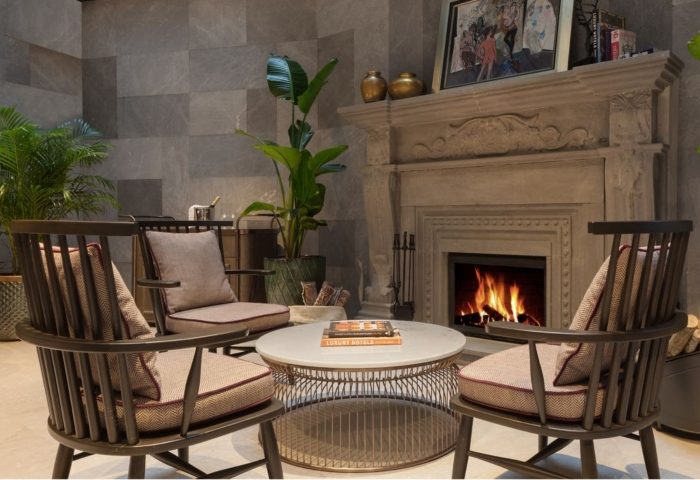 Burdock Hotel Istanbul Christmas & New Year deals: Cozy seating area with fireplace. Gay hotel interior, Autograph Collection.