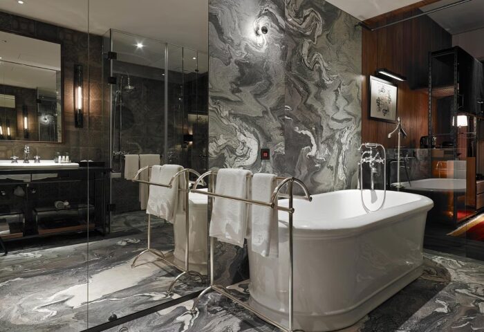 Hotel Proverbs Taipei bathroom. Best design gay-friendly hotel in Taipei City Center. Marble walls, soaking tub, and modern fixtures.