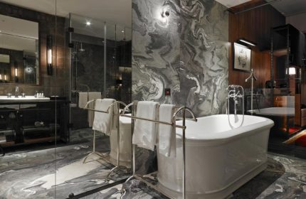 Hotel Proverbs Taipei bathroom. Best design gay-friendly hotel in Taipei City Center. Marble walls, soaking tub, and modern fixtures.