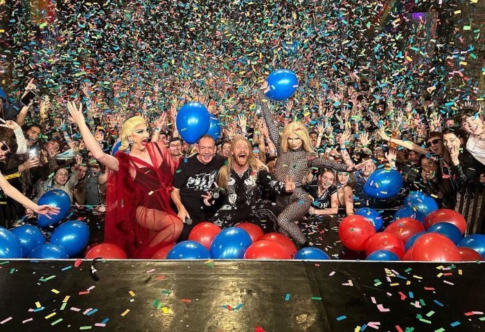 G-A-Y Late, best gay dance club in Soho: Drag queens and performers on stage with a crowd of people and confetti falling from the ceiling.
