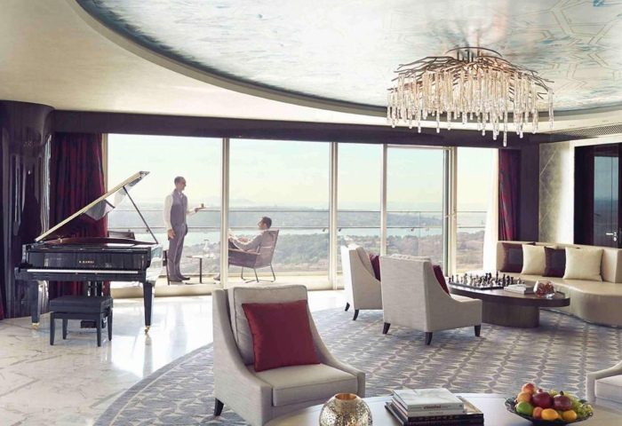 Raffles Istanbul Hotel suite. Luxury gay-friendly hotel with piano, balcony view, and impeccable service. Perfect for gay travel in Istanbul.
