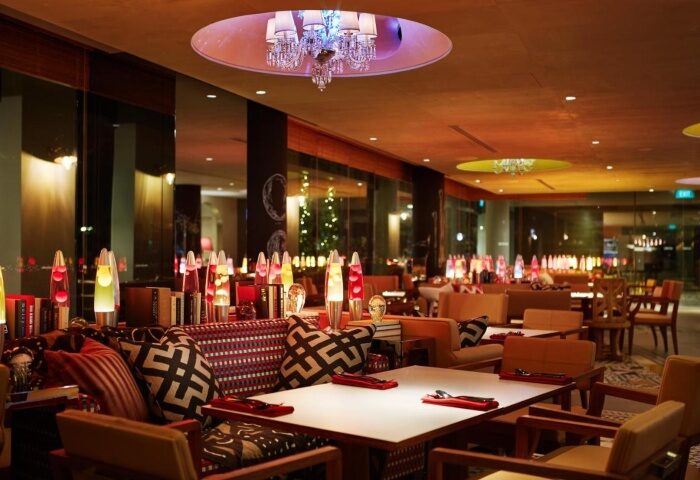 M Social Singapore's stylish interior. A best gay hangout hotspot hotel with a chandelier, lava lamps, and modern decor. Gay travel advice.