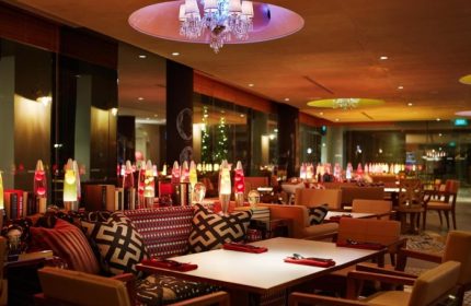 M Social Singapore's stylish interior. A best gay hangout hotspot hotel with a chandelier, lava lamps, and modern decor. Gay travel advice.