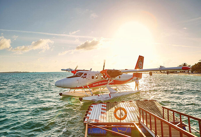 Seaplane at LUX* South Ari Atoll, Maldives. Best gay honeymoon destination. Tropical island getaway for LGBTQ+ couples.