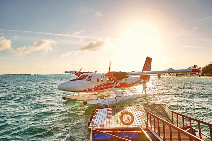 Seaplane at LUX* South Ari Atoll, Maldives. Best gay honeymoon destination. Tropical island getaway for LGBTQ+ couples.