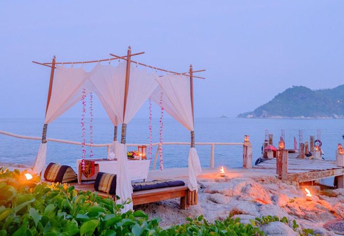Santhiya Koh Phangan Resort & Spa's romantic private pool villa setup for a gay honeymoon. Beachfront dining, idyllic Koh Phangan getaway.