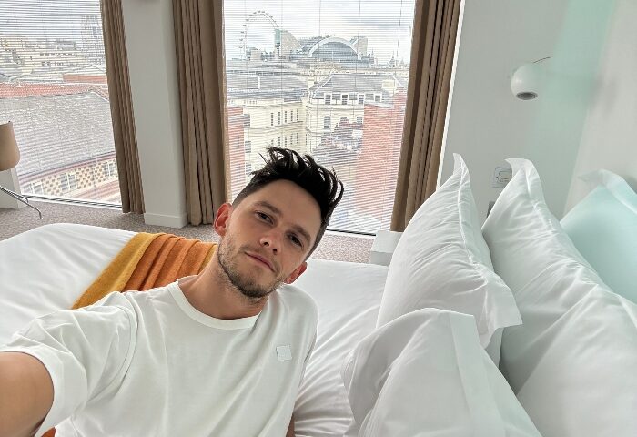 Gay traveler at St Martins Lane Hotel, London. Room view of London Eye. Best gay hotel near Big Ben. Gay travel advice.